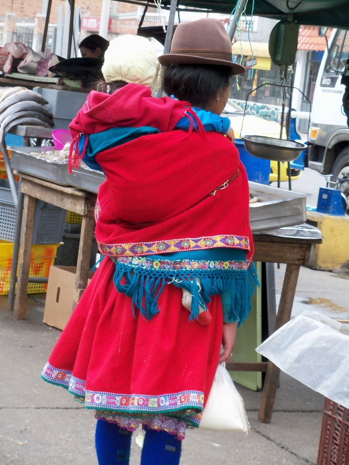 Hope you enjoy this woman's vibrant everyday dress.  Don't you love the baby on her back?
