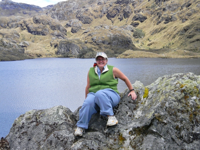 Kathy on a rock with the lagoon behind--(Juan's image)