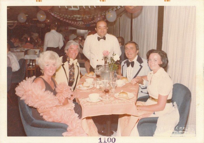 My parents are on the left--my mother in the feather boa.