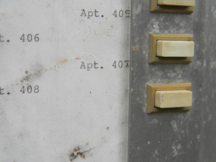 There's now an intercom system in the building.  Here's the button one would push to call apartment 407.
