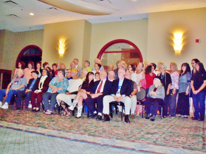 Inductees into the World Massage Hall of Fame over the past decade. My Godmother is seated in the second row, far right, holding a photo of Raul from my cell phone.